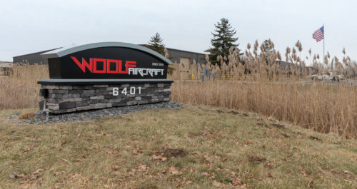 Woolf Aircraft sign on the side of facility