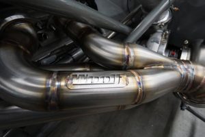 Fabricated metal pipe as part of an engine